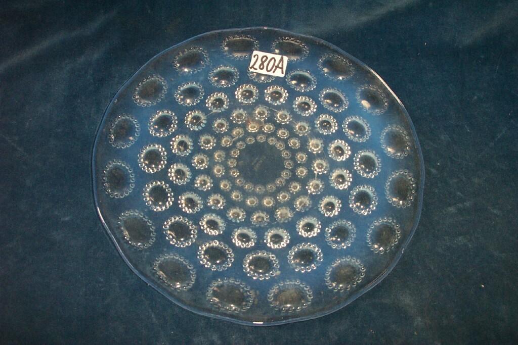 Appraisal: A Lalique opalescent glass plate with moulded graduated stylised flower