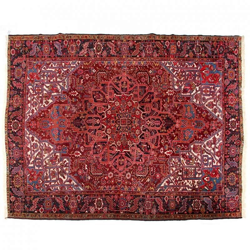 Appraisal: Heriz Carpet circa the dark red field with red medallion