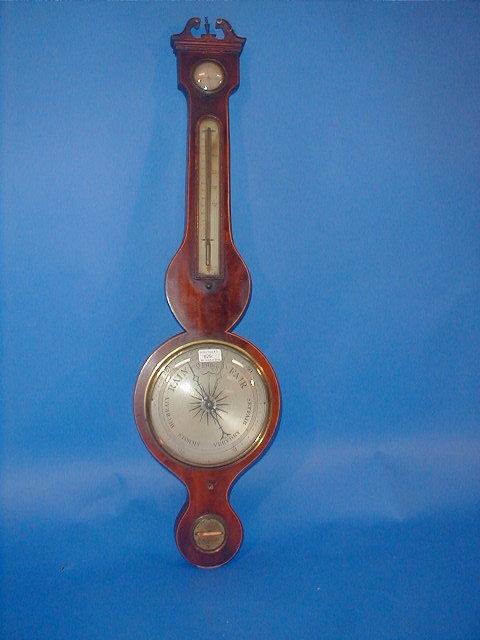 Appraisal: An early thC flamed mahogany wheel barometer with swan neck