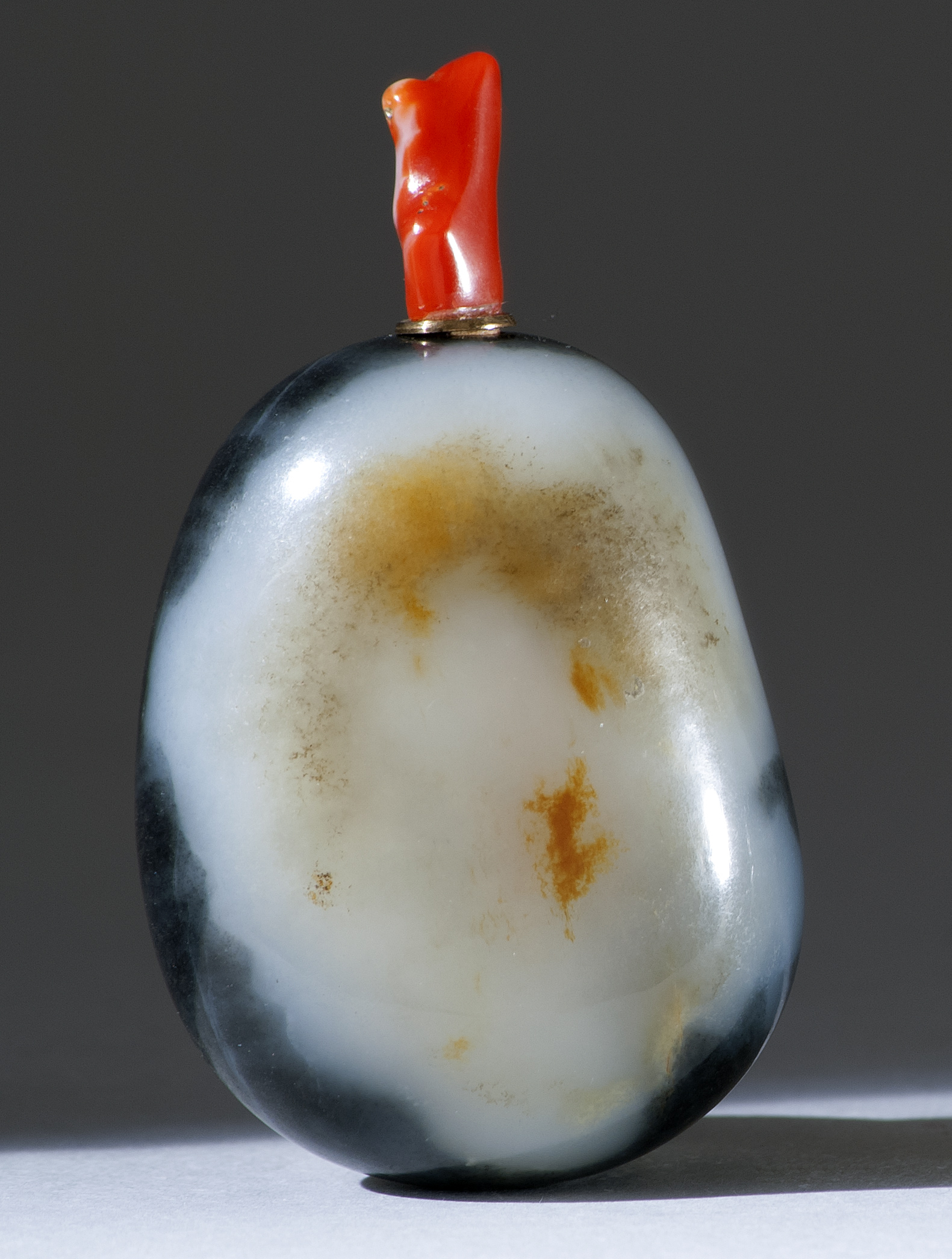 Appraisal: BLACK AND WHITE JADE SNUFF BOTTLE th CenturyIn pebble form