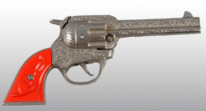 Appraisal: Cast Iron Gene Autry Toy Cap Gun Description Engraving on