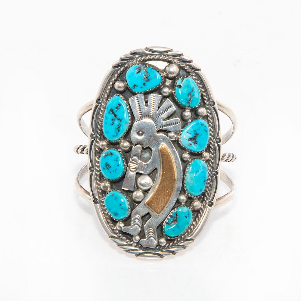 Appraisal: TOMMY MOORE NAVAJO SILVER TURQUOISE AND GOLD BRACELET Inset turquoise