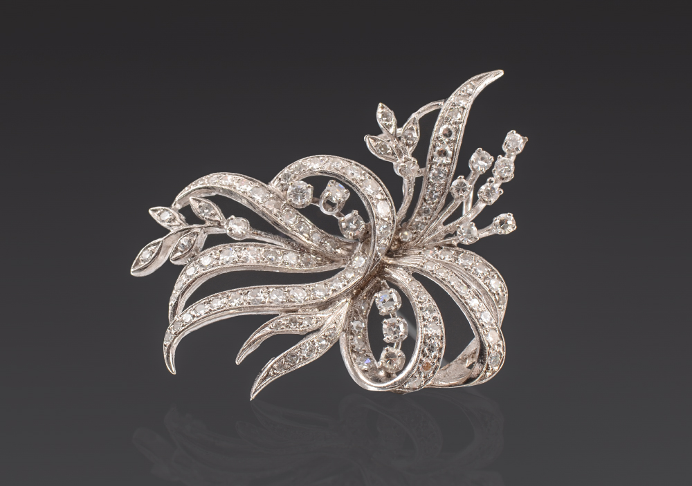 Appraisal: ELEGANT DIAMOND BROOCH round single and round brilliant cut diamonds