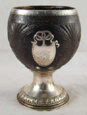 Appraisal: A large silver mounted coconut cup finely carved on gadrooned