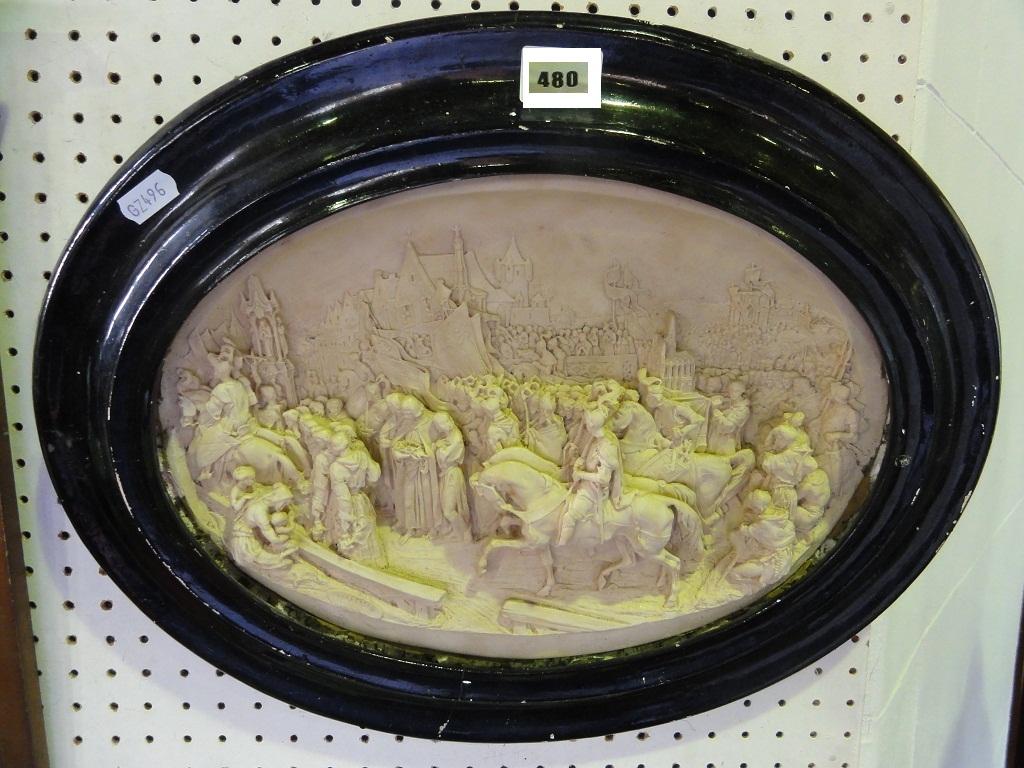 Appraisal: An oval plaster relief of a religious procession possibly in