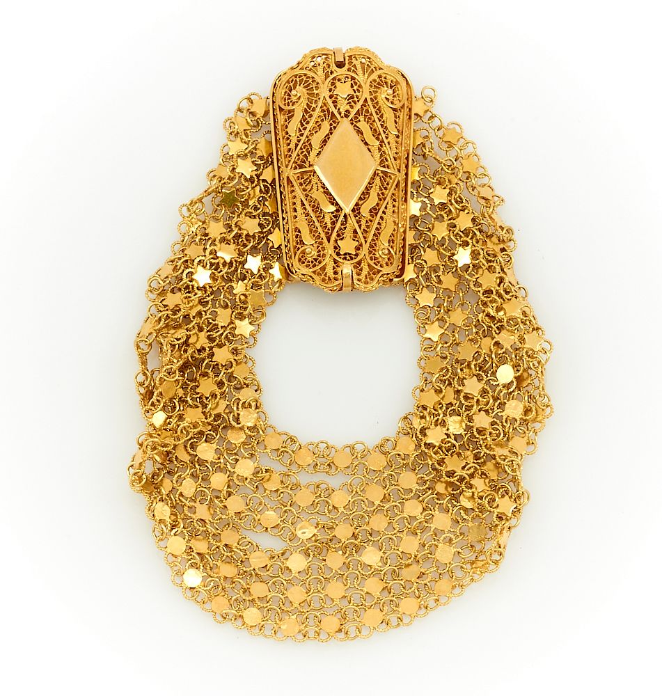 Appraisal: k Yellow gold bracelet with a large ornate filigree clasp