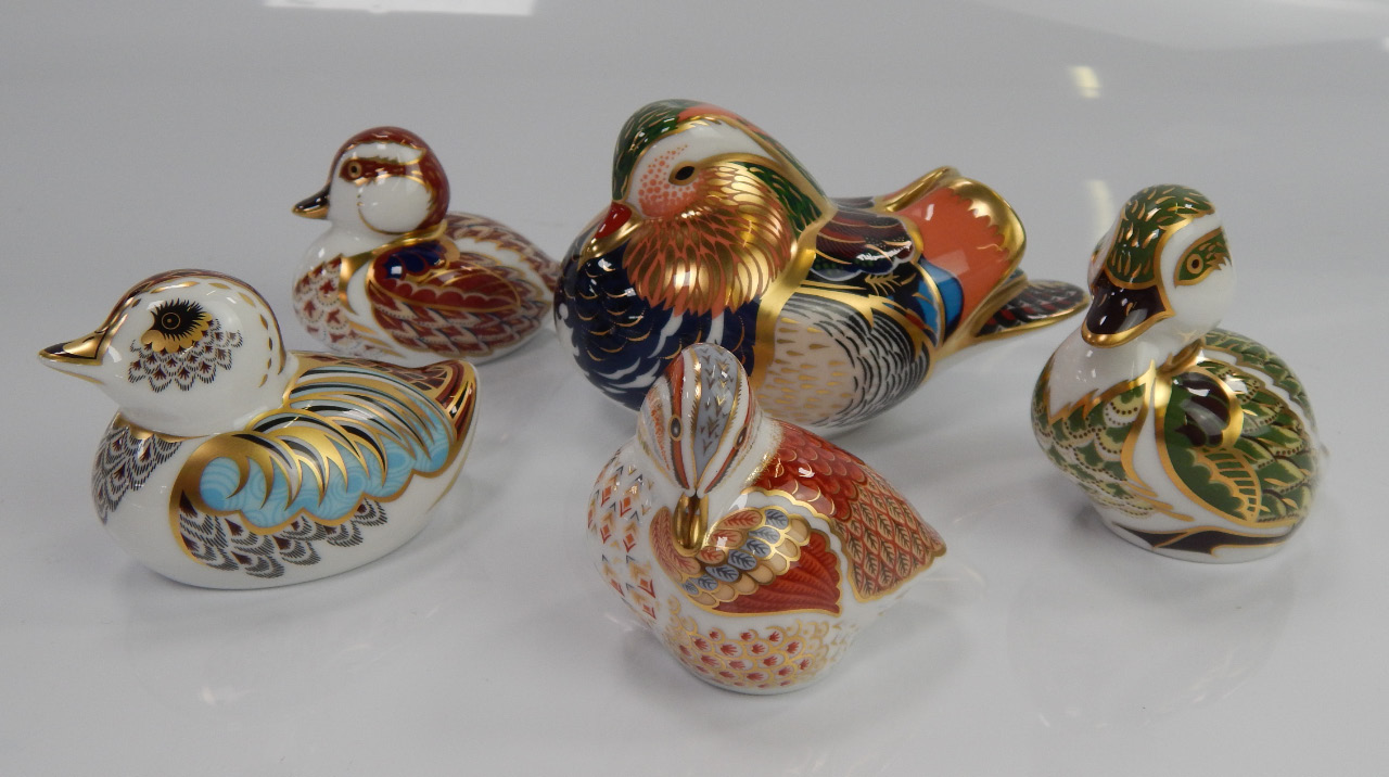 Appraisal: A Royal Crown Derby Mandarin Duck and four duckling paperweights