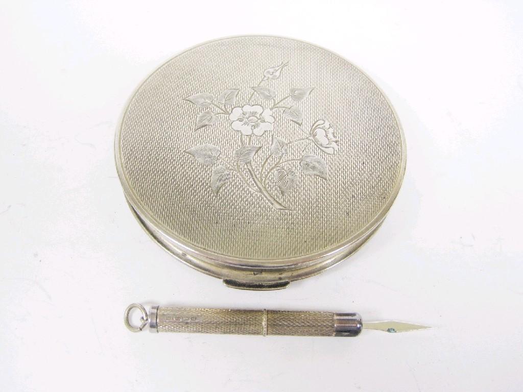 Appraisal: A circular Powder Compact with engine turning and engraved flowers