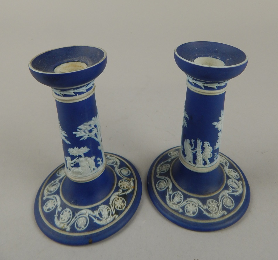 Appraisal: A pair of late thC dark blue Wedgwood Jasperware candlesticks