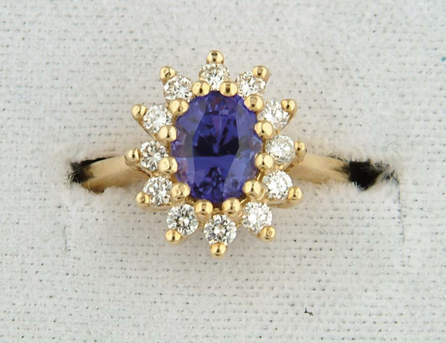 Appraisal: K YELLOW GOLD TANZANITE AND DIAMOND RING Setting marked k