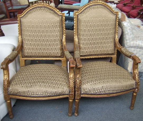 Appraisal: A pair of Louis XVI style gilt framed open armchairs