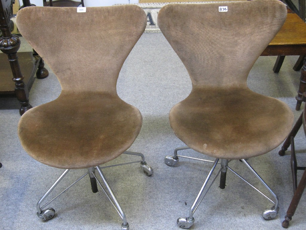 Appraisal: Pair of th Century design upholstered and chrome swivel chairs