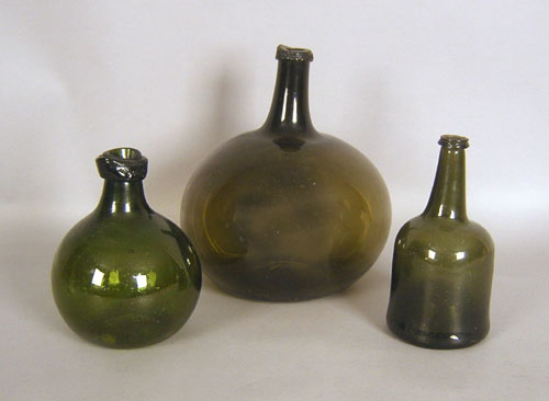 Appraisal: Three olive glass bottles th c h h and h