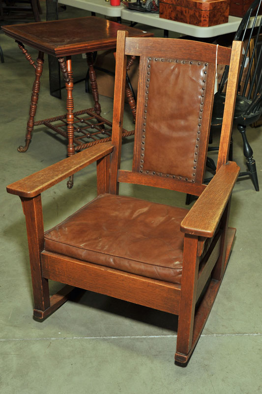 Appraisal: ARTS AND CRAFTS ARMCHAIR ROCKER Oak rocker with brown leather