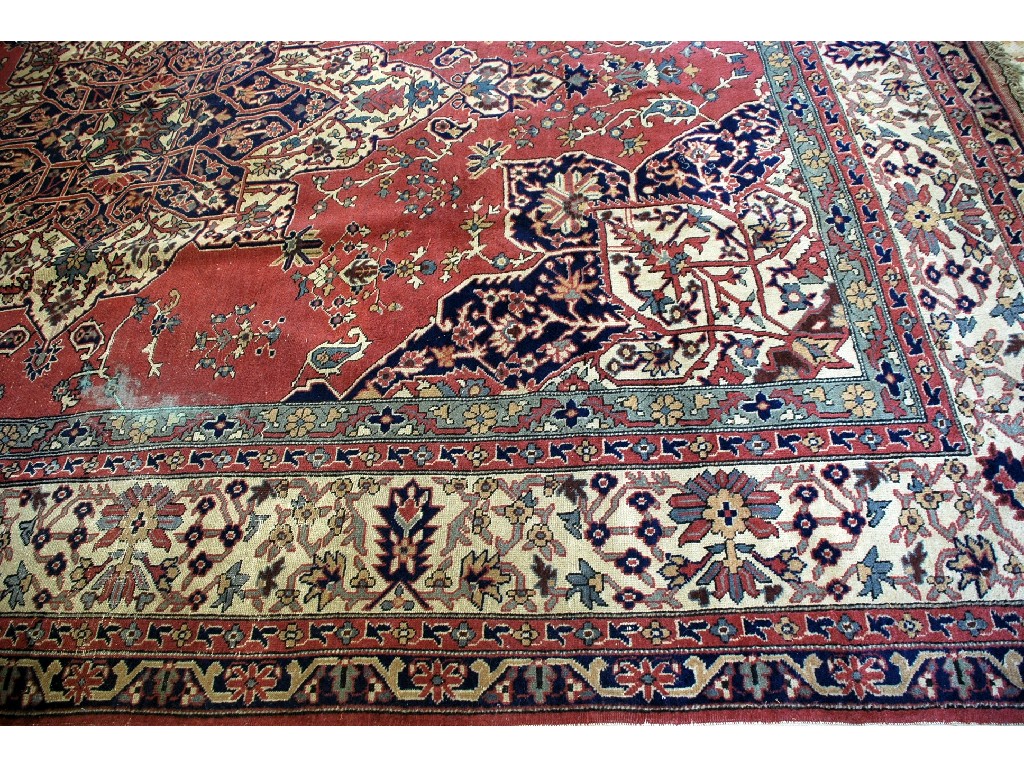 Appraisal: LARGE EASTERN CARPET with diamond shaped centre medallion with pendants