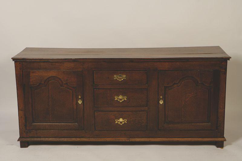 Appraisal: A GEORGE III OAK DRESSER BASE the rectangular top above