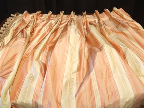 Appraisal: PAIR OF PEACH AND CREAM SILK STRIPED CURTAIN PANELS With