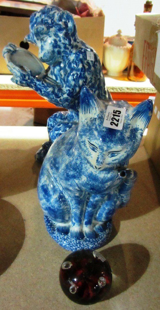 Appraisal: A ceramic figure of a monkey a jug modelled as