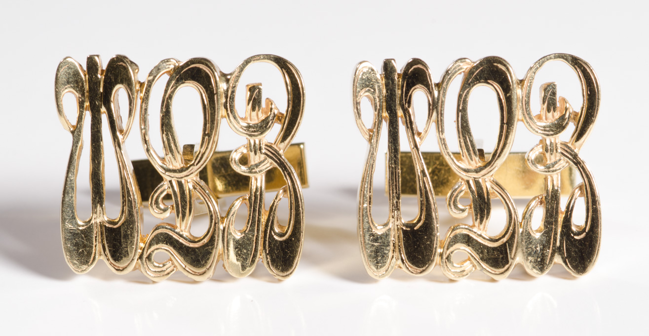 Appraisal: A PAIR OF FOURTEEN KARAT GOLD MONOGRAM CUFFLINKS each with