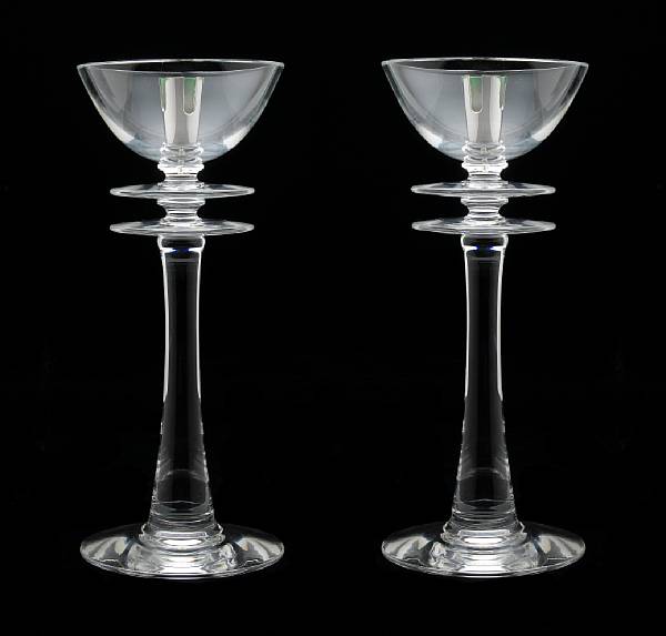 Appraisal: A pair of Steuben glass double disk candlesticks designed by