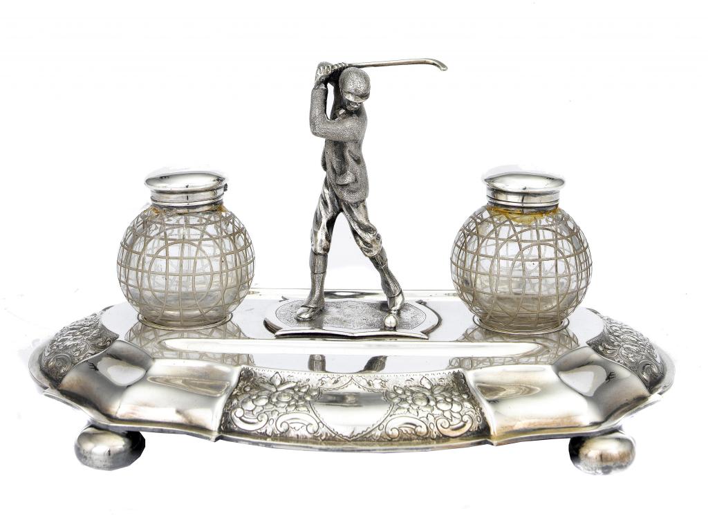 Appraisal: GOLF AN INKSTAND of moulded and serpentine sided form surmounted