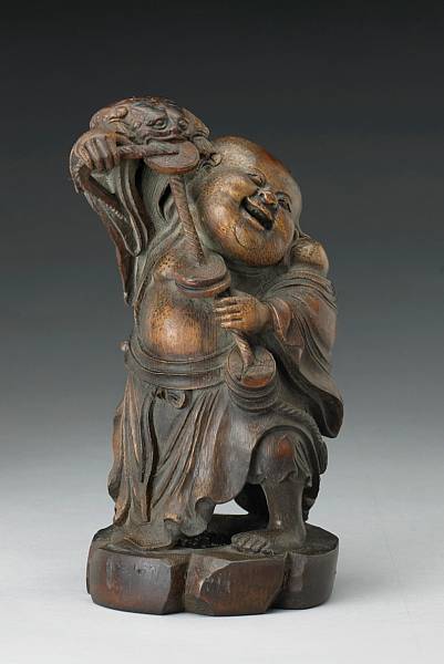 Appraisal: A carved bamboo figure of Liu Hai Late Qing The