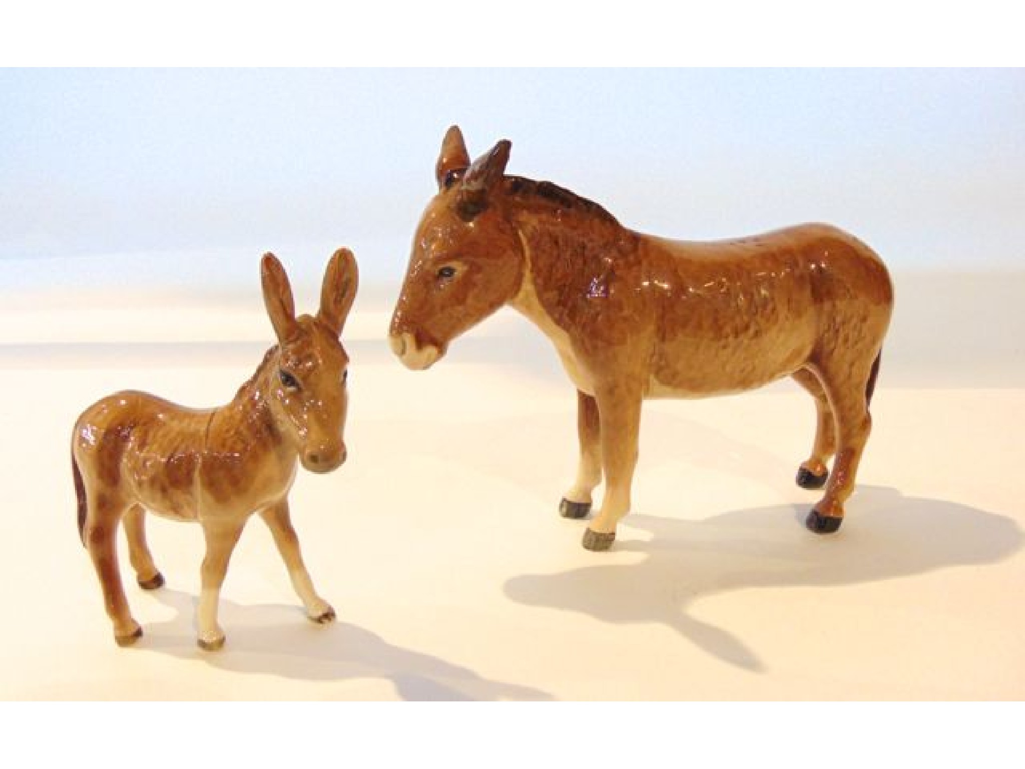 Appraisal: Two Beswick models of a donkey and a foal