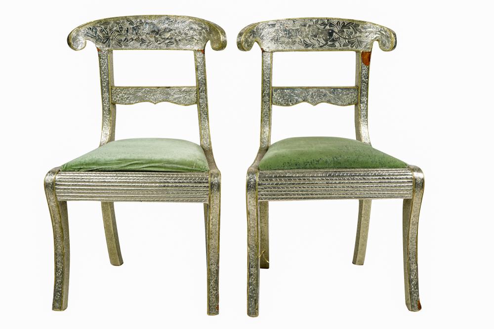 Appraisal: FOUR ANGLO INDIAN SILVERED METAL CHAIRSeach with green velvet cushion