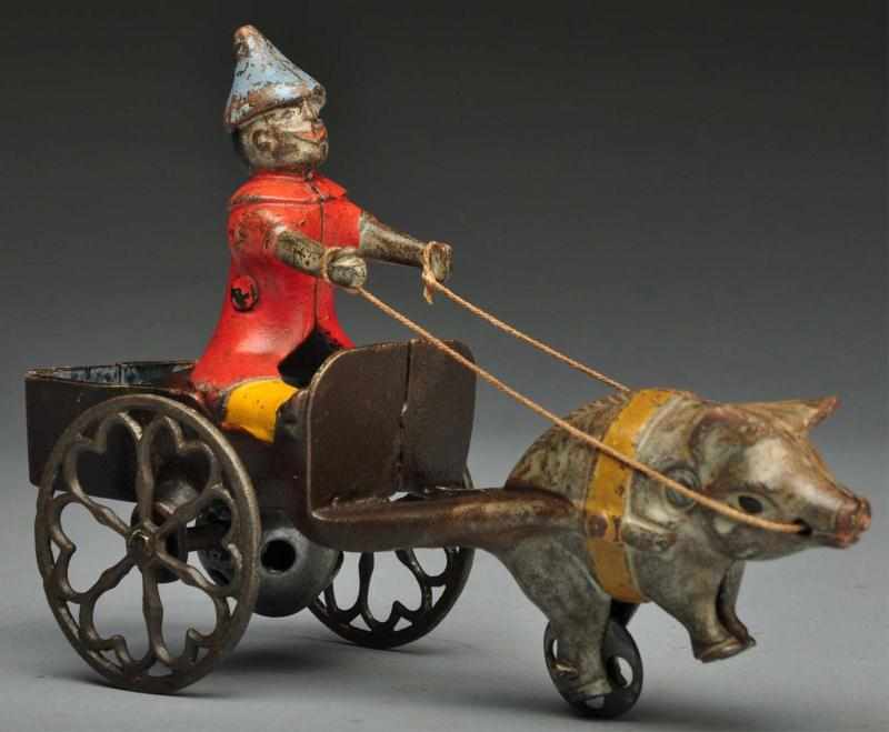 Appraisal: Cast Iron Gong Bell Co Clown Pig Cart Bell Toy