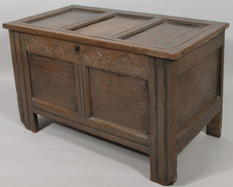 Appraisal: A late thC oak panel coffer the rectangular lid hinging