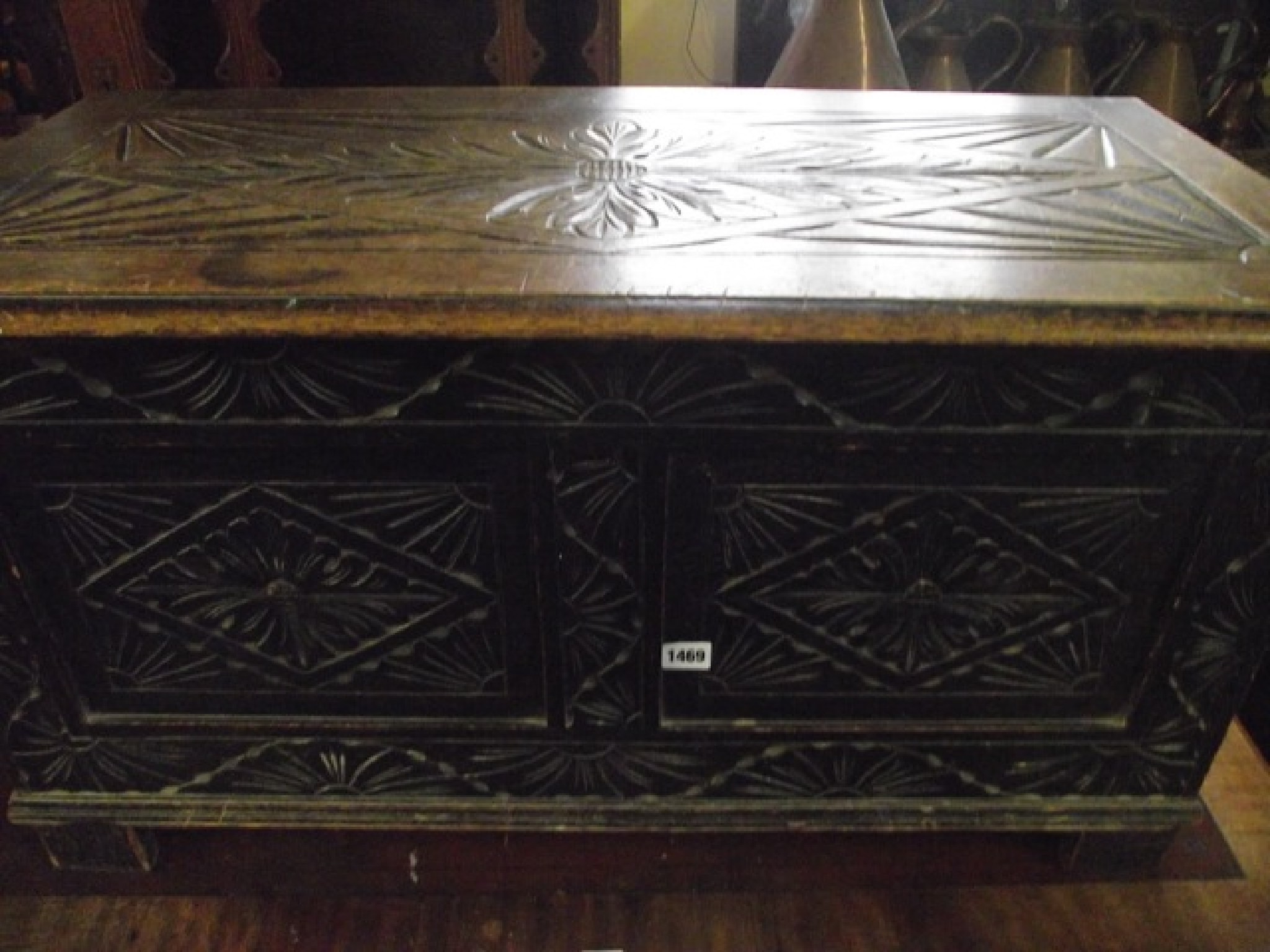 Appraisal: A th century oak blanket chest with rising lid prefusely