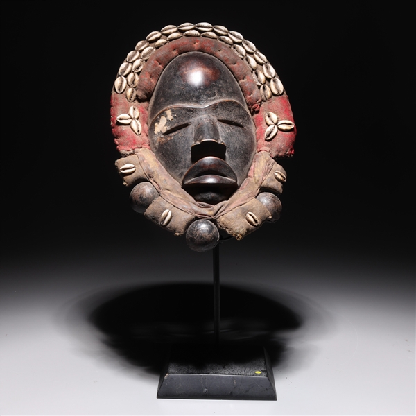 Appraisal: Elaborate West African carved wood Dan mask with fabric and