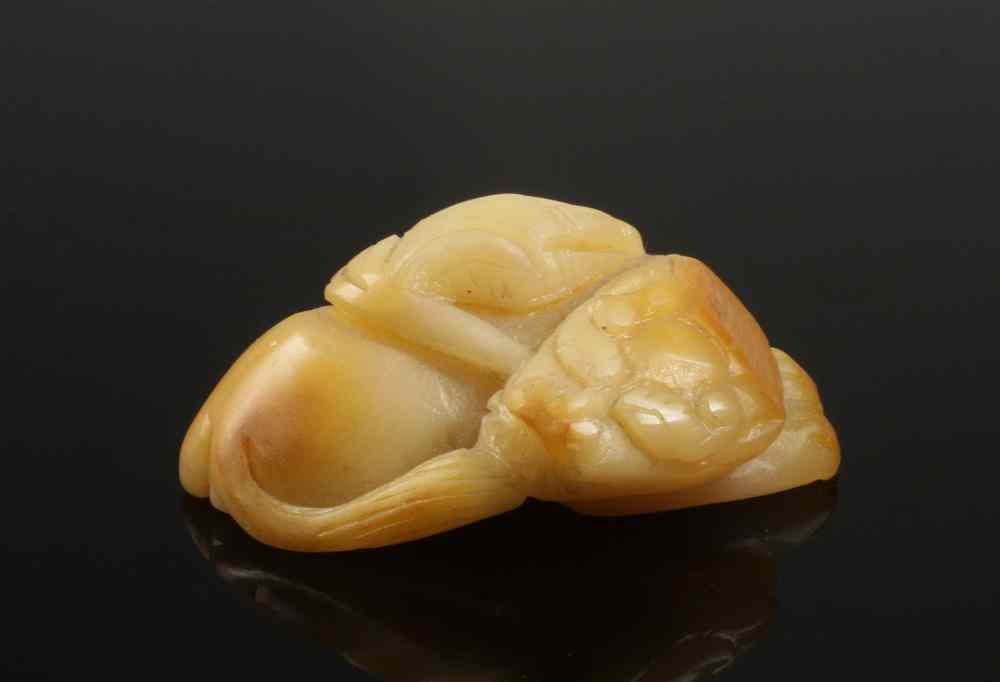 Appraisal: CHINESE JADE FIGURINE - Carved white jade with amber accents