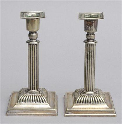 Appraisal: PAIR OF LATIN AMERICAN SILVER-PLATED COLUMN-FORM SHORT CANDLESTICKS Each reeded