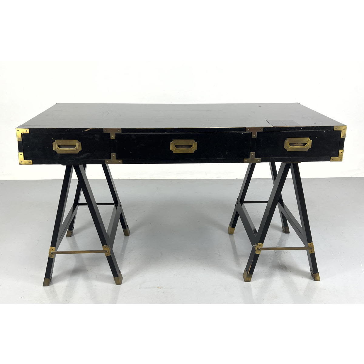 Appraisal: Black Lacquered Campaign style Desk Saw Horse Bases Brass Pulls