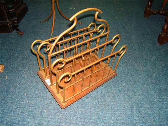 Appraisal: A Victorian oak and brass table top magazine rack with