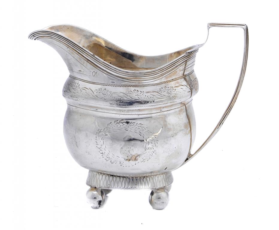 Appraisal: A GEORGE III BRIGHT CUT CREAM JUG with reeded handle