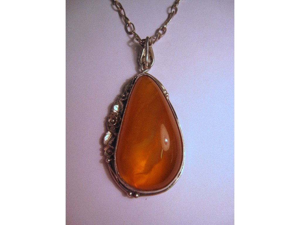 Appraisal: Large amber pendant in Art Nouveau silver mount with silver