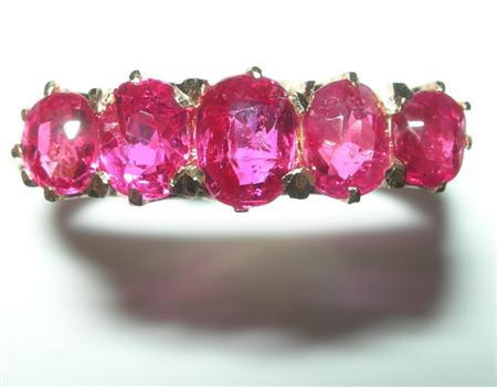 Appraisal: A ruby five-stone ring claw set with graduated oval cut