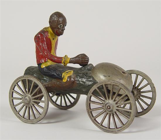 Appraisal: Cast Iron Pull Toy th Century Black man riding a