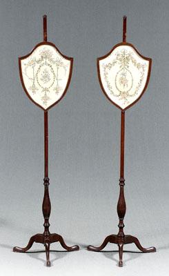 Appraisal: Pair Regency style pole screens mahogany each shield form screen