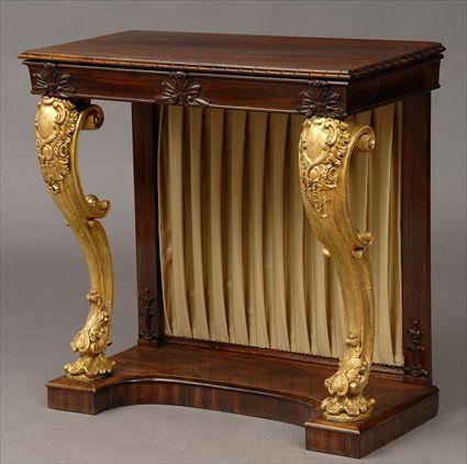 Appraisal: REGENCY ROSEWOOD AND CARVED GILTWOOD CONSOLE TABLE The leaf-carved top