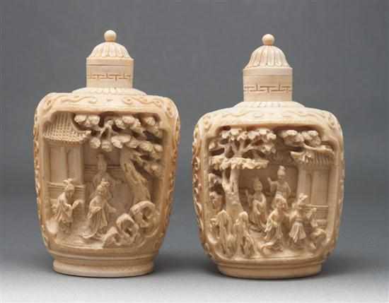 Appraisal: Near pair of Chinese carved ivory snuff bottles each with