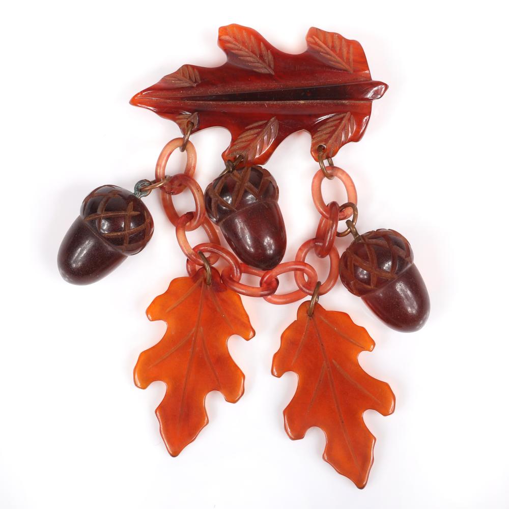 Appraisal: BAKELITE VINTAGE CARVED AUTUMN OAK LEAF PIN WITH AMBER CELLULOID