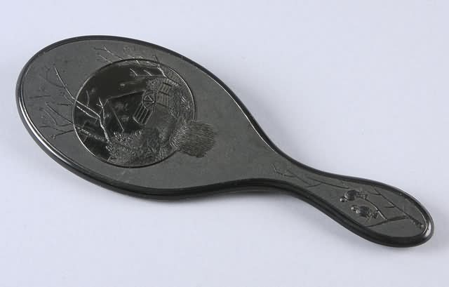 Appraisal: Union thermoplastic hand mirror featuring mill and mill stream motif