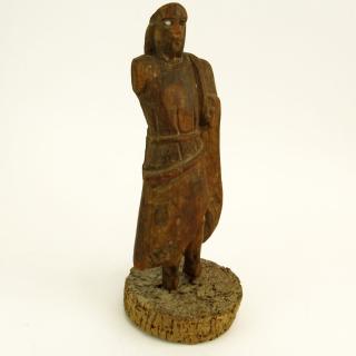 Appraisal: Early Continental Wood Carving of a Man on Cork Base