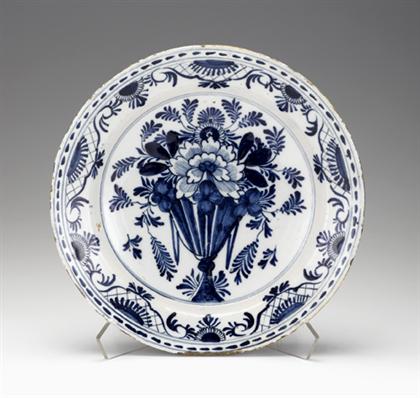 Appraisal: Delft blue and white charger th century The center decorated