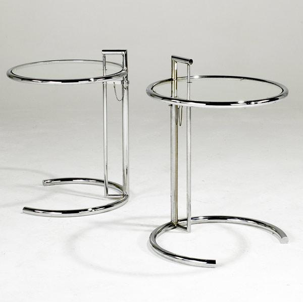 Appraisal: EILEEN GRAY Pair of adjustable occasional tables in chromed steel