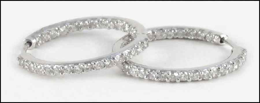 Appraisal: PAIR OF DIAMOND AND KARAT WHITE GOLD HOOP EARRINGS round