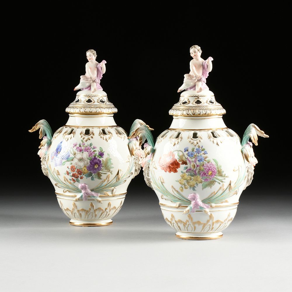 Appraisal: A PAIR OF BERLIN KPM FLORAL PAINTED PORCELAIN LIDDED URNS